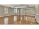 Bright living room with hardwood floors, a chandelier, built-in shelving, and a large window at 1324 Concord Sw Cir, Lilburn, GA 30047