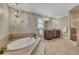 Luxurious main bathroom with soaking tub, walk-in shower and dual vanity at 1324 Concord Sw Cir, Lilburn, GA 30047