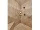 Close-up of a tiled walk-in shower with diamond pattern accent, seating, and wall mounted shelves at 1324 Concord Sw Cir, Lilburn, GA 30047