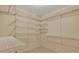 Walk-in closet with white wire shelving on multiple walls, offering ample storage space at 1324 Concord Sw Cir, Lilburn, GA 30047