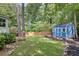 Private backyard featuring a storage shed and lush green lawn at 2716 Meadow Ridge Nw Dr, Duluth, GA 30096
