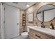 Charming bathroom with exposed brick wall, modern fixtures, and a wood vanity at 2716 Meadow Ridge Nw Dr, Duluth, GA 30096