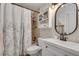 Bathroom featuring a shower and tub combination with white floral shower curtains at 2716 Meadow Ridge Nw Dr, Duluth, GA 30096