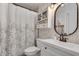 Stylish bathroom with a framed mirror, vanity, and a shower featuring a decorative curtain at 2716 Meadow Ridge Nw Dr, Duluth, GA 30096