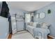 Cozy bedroom with light blue walls, white trim, a daybed, and decorative touches creating a relaxing space at 2716 Meadow Ridge Nw Dr, Duluth, GA 30096