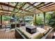 Outdoor deck area featuring comfortable seating, a fire pit, and a dining table at 2716 Meadow Ridge Nw Dr, Duluth, GA 30096