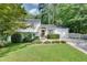 Charming two-story home with a well-manicured lawn and lush landscaping at 2716 Meadow Ridge Nw Dr, Duluth, GA 30096