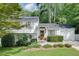 Charming two-story home with a well-manicured lawn and lush landscaping at 2716 Meadow Ridge Nw Dr, Duluth, GA 30096