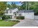 Inviting two-story home with an attached garage and well-maintained front lawn at 2716 Meadow Ridge Nw Dr, Duluth, GA 30096
