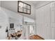 Upstairs hallway with a view of the dining room and a set of doors leading to storage space at 2716 Meadow Ridge Nw Dr, Duluth, GA 30096
