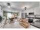 Spacious kitchen with white cabinets, granite countertops, stainless steel appliances, and an open view to the dining area at 2716 Meadow Ridge Nw Dr, Duluth, GA 30096