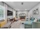 Comfortable living room with a stone fireplace, plush seating, and ample natural light at 2716 Meadow Ridge Nw Dr, Duluth, GA 30096