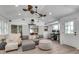 Bright sunroom featuring white trim, comfortable seating, and a view to an office and the front of the house at 2716 Meadow Ridge Nw Dr, Duluth, GA 30096