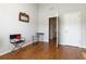Bright room featuring hardwood floors, neutral walls, and great natural light for flexible living at 5351 Paramount View Way, Sugar Hill, GA 30518