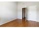 Bright bedroom with hardwood floors, offering a clean and versatile space for relaxation or customization at 5351 Paramount View Way, Sugar Hill, GA 30518