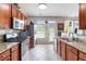Well-equipped kitchen with stainless steel appliances, granite countertops, and ample cabinet space at 5351 Paramount View Way, Sugar Hill, GA 30518