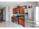 Modern kitchen with stainless steel appliances and granite countertops with lots of cabinet space at 5351 Paramount View Way, Sugar Hill, GA 30518