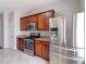 Modern kitchen featuring stainless steel appliances, granite countertops, and ample cabinet space at 5351 Paramount View Way, Sugar Hill, GA 30518