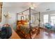 Comfortable main bedroom featuring a four-poster bed, hardwood floors, and natural light at 5351 Paramount View Way, Sugar Hill, GA 30518