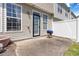 Cozy patio area with vinyl siding, privacy fence, and grill at 5351 Paramount View Way, Sugar Hill, GA 30518