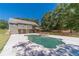 The spacious backyard features an in-ground pool, hot tub, and two-story home at 664 Johnson Rd, Oxford, GA 30054