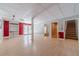 Finished basement with hardwood style floors, leading to an outdoor patio at 664 Johnson Rd, Oxford, GA 30054