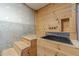 Unique pet bath in unfinished basement with concrete walls and wood paneling at 664 Johnson Rd, Oxford, GA 30054