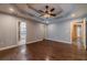 Open bedroom with beautiful wood flooring, trey ceilings, and access to other rooms at 664 Johnson Rd, Oxford, GA 30054