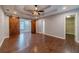 Spacious bedroom with wood floors, tray ceiling, barn doors, and walk-in closet at 664 Johnson Rd, Oxford, GA 30054