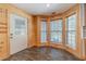 Charming breakfast nook with wood paneling, lots of natural light, and exterior door access at 664 Johnson Rd, Oxford, GA 30054