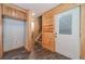 Mudroom and entryway leads to a staircase, storage space, and exterior access at 664 Johnson Rd, Oxford, GA 30054