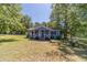 Exterior view of small home with a front porch at 664 Johnson Rd, Oxford, GA 30054
