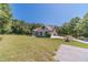 Exterior view of house with a green lawn and an attached garage at 664 Johnson Rd, Oxford, GA 30054