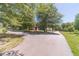 Exterior view showing a circular driveway and outbuildings at 664 Johnson Rd, Oxford, GA 30054