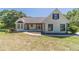 Charming home featuring a white painted brick exterior, black shutters, and a lovely front lawn at 664 Johnson Rd, Oxford, GA 30054