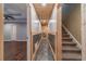 Basement hallway leads to stairs, bedroom, and unfinished utility spaces at 664 Johnson Rd, Oxford, GA 30054