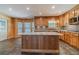 Kitchen featuring granite counters, stainless steel appliances, custom cabinets, and a center island at 664 Johnson Rd, Oxford, GA 30054