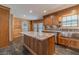 Kitchen featuring granite counters, stainless steel appliances, custom cabinets, and center island at 664 Johnson Rd, Oxford, GA 30054