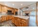 Open kitchen with island, stainless appliances, stone backsplash, and ample cabinet space at 664 Johnson Rd, Oxford, GA 30054