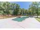 Gorgeous backyard with an in-ground pool, hot tub and mature trees at 664 Johnson Rd, Oxford, GA 30054