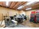 Unfinished basement with exposed ceiling and a variety of tools and equipment at 7430 Ramsgate Ct, Cumming, GA 30040