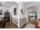 Inviting hallway showcasing hardwood floors, elegant trim, and an open floor plan leading to the main living area at 7430 Ramsgate Ct, Cumming, GA 30040