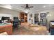 Large office with hardwood floors, ceiling fan, and built in bookshelves at 7430 Ramsgate Ct, Cumming, GA 30040
