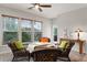 Cozy sunroom with lots of natural light, wicker furniture, and verdant views at 7430 Ramsgate Ct, Cumming, GA 30040