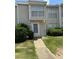 Charming townhome with manicured landscaping and a welcoming front entrance at 102 Governors Dr, Forest Park, GA 30297