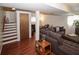 Finished basement featuring stairs to the upstairs and a large couch at 125 Pebble Beach Ct, Atlanta, GA 30349