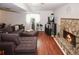 Finished basement with a large couch and stone fireplace at 125 Pebble Beach Ct, Atlanta, GA 30349