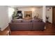 Finished basement with a large couch and stone fireplace at 125 Pebble Beach Ct, Atlanta, GA 30349
