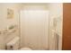 Bathroom with a shower, toilet and storage shelf at 125 Pebble Beach Ct, Atlanta, GA 30349