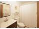 Bathroom featuring a shower with a curtain, toilet and vanity at 125 Pebble Beach Ct, Atlanta, GA 30349